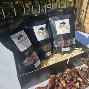 Signature Collection gift set with 150g biltong, 150g dry wors, and 150g chilli bites in a premium black hamper box